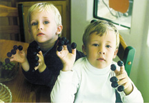 My two beautiful boys (a few years younger) demonstrate the second best thing to do with Thanksgiving olives.